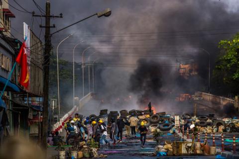 Tires block a street in Myanmar