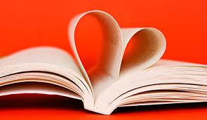 Open white book in shape of a heart with a red background