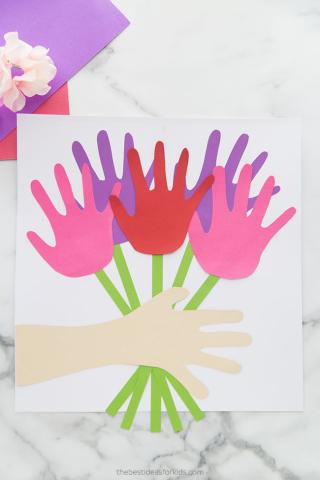 Multicolored handprint flower bouquet with green stems