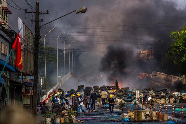 Tires block a street in Myanmar