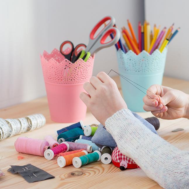 child sewing