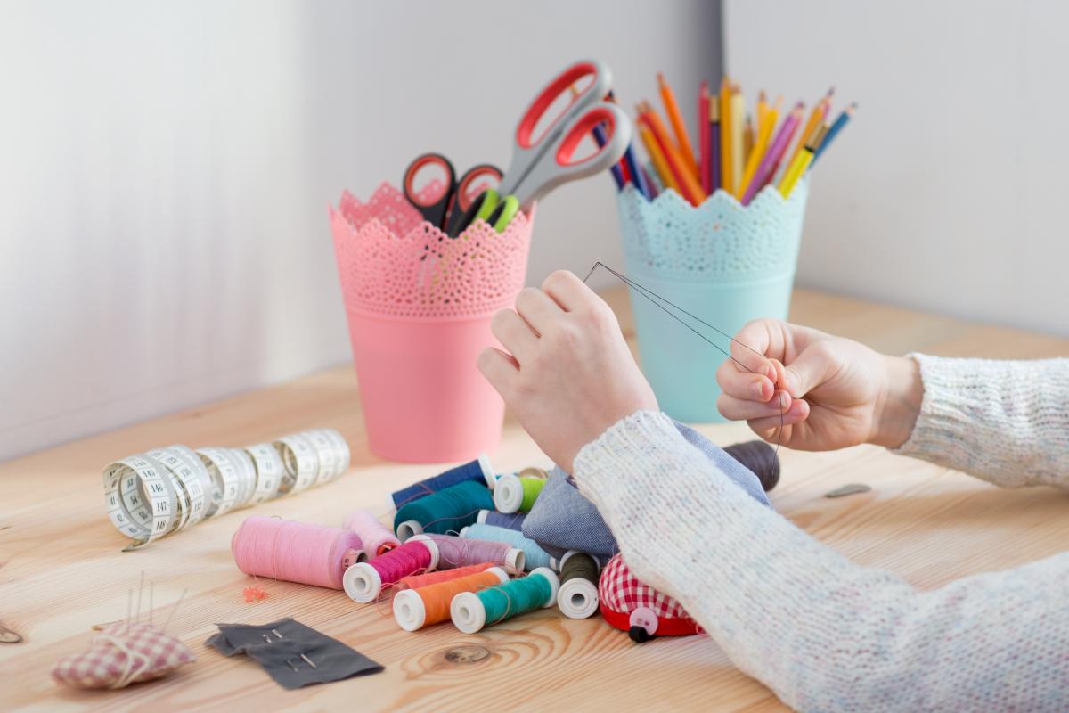 child sewing