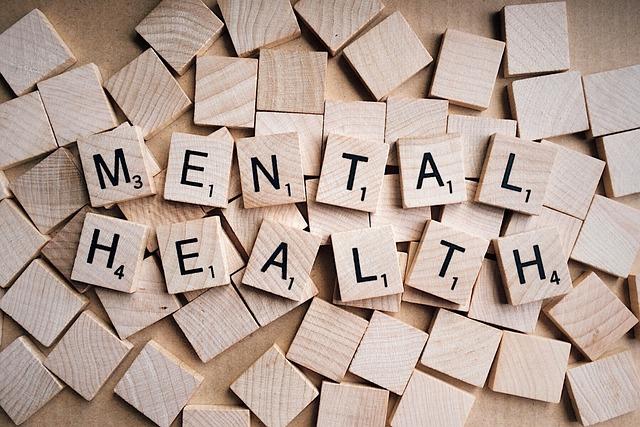 Beige wooden tiles spelling "Mental Health"